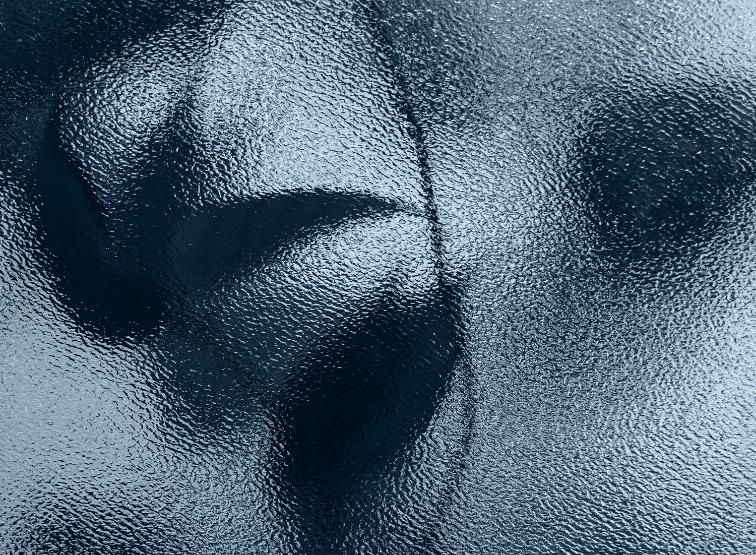 Textured surface with shades of blue and gray.