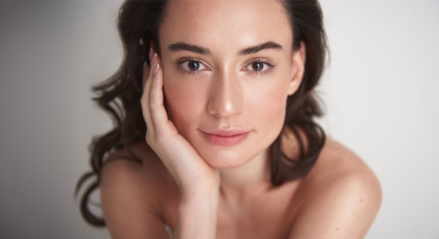 Close-up of woman with natural beauty and expression.