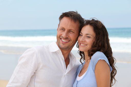 couple smiling on the beach