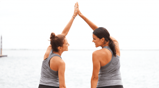 two women high fiving